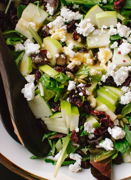 Simple green salad with apple, pepitas, cranberries and goat cheese! cookieandkate.com