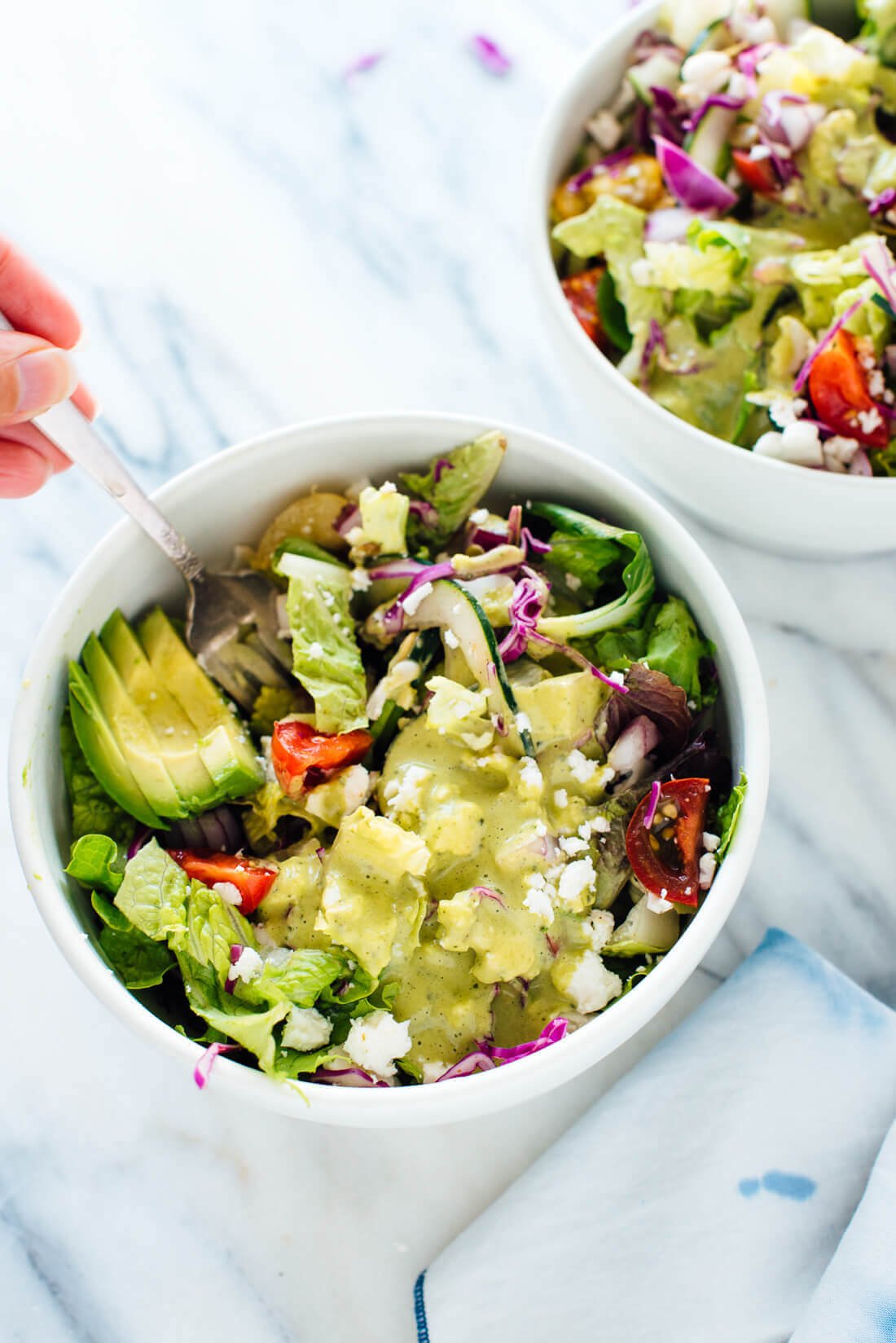 This delicious Mexican green salad with jalapeño-cilantro dressing is super fresh and mega nutritious! Vegetarian (easily vegan) and gluten free. cookieandkate.com