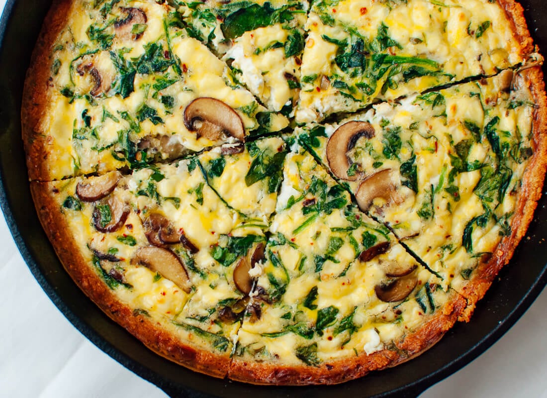 Cremini mushroom and arugula quiche in a gluten-free almond meal crust
